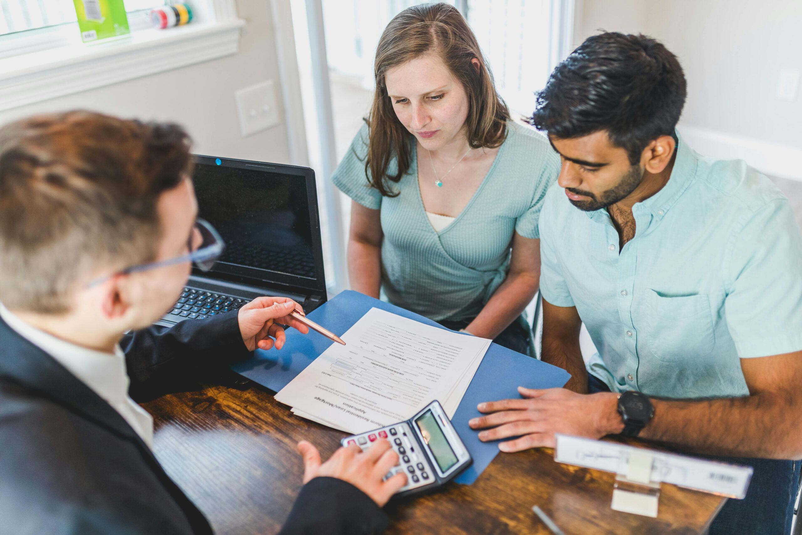 couple signing mortgage paperwork
